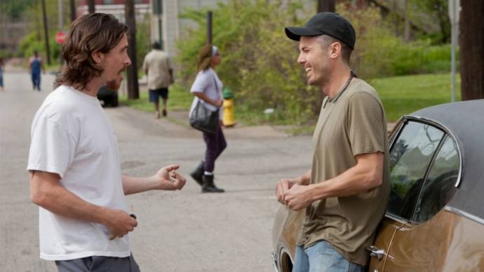 Christian Bale (Russell Baze) en Casey Affleck (Rodney Baze Jr.)