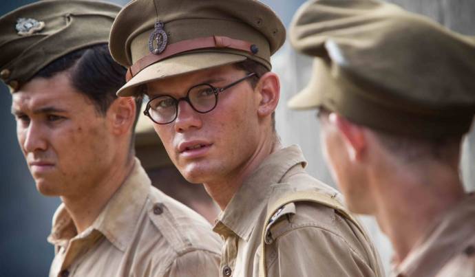 Jeremy Irvine (Young Eric Lomax)